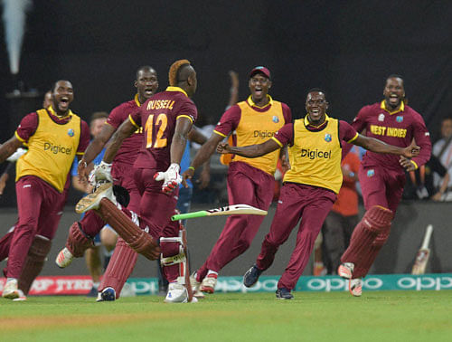 GATE-CRASHERS! West Indian players celebrate thier victroy against India during the ICC T20 World cup semi final match in Mumbai on Thursday. PTI Photo