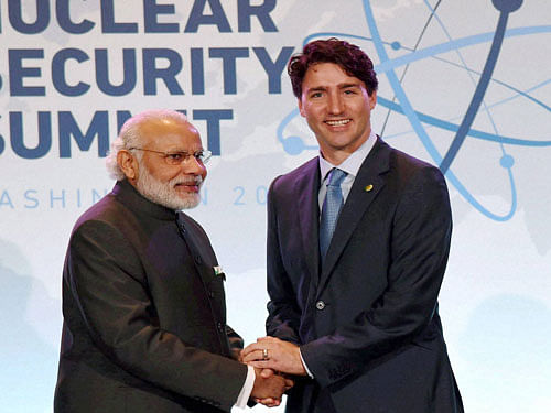 Prime Minister Narendra Modi shakes hands with Canadian Prime Minister Justin Trudeau during a bilateral meeting at the Nuclear Security Summit, in Washington Friday. PTI Photo
