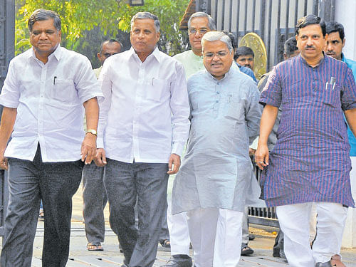 BJP leaders Jagadish Shettar, V&#8200;Somanna, Govind M  Karjol and Pralhad Joshi leave Raj Bhavan, after submitting a memorandum to Governor Vajubhai Vala  in Bengaluru on Saturday. dh photo