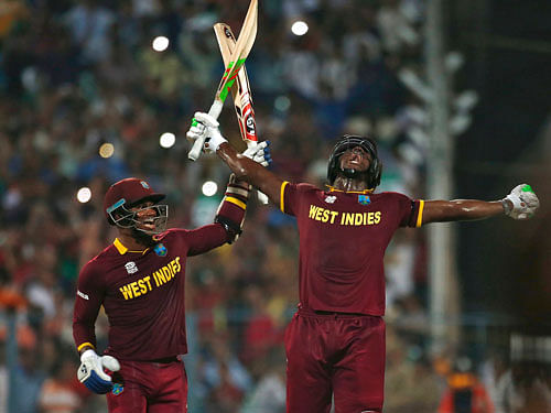 West Indies Carlos Brathwaite (R) and Marlon Samuels celebrate after winning the final. REUTERS Photo