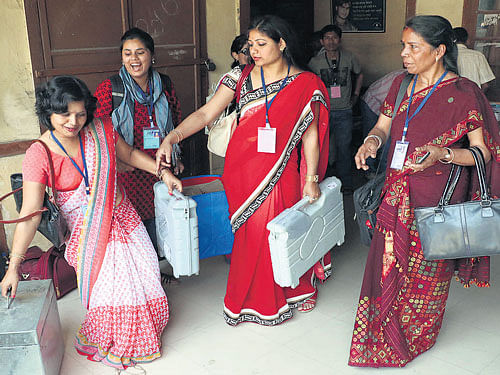 Round one: All women polling party along with electronic voting machines leave for their designated stations  in Jorhat district of Assam on Sunday. Parikhit Saikia