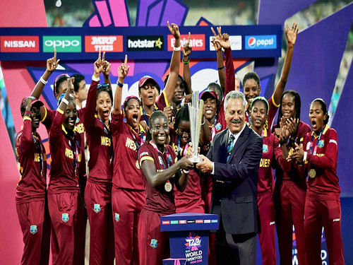 ICC Women's World T20 2016 champion West Indies cricketers receive the champion's trophy at the Eden Gardens in Kolkata on Sunday. PTI Photo