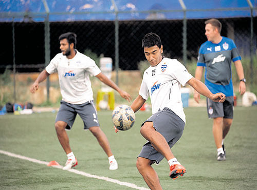 CONTROLLED: Bengaluru FC's Daniel Lalhlimpuia (centre) during a training session. BFC MEDIA