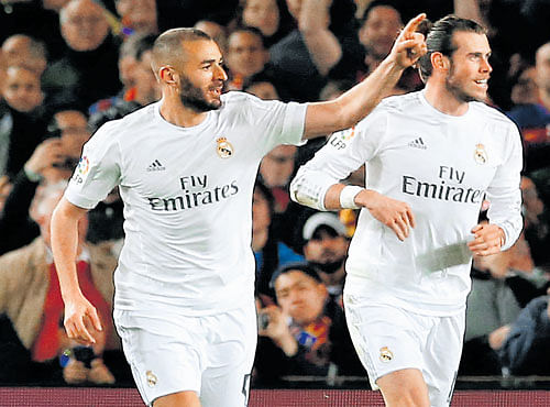 TALISMAN: RealMadrid's in-formKarim Benzema (left) and Gareth Bale will look to tame Vfl Wolfsburg in their Champions League quarter final fixture on Wednesday. REUTERS