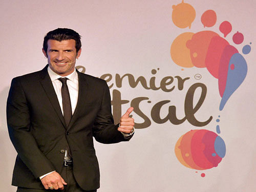 Real Madrid FC and Portuguese soccer legend Luis Figo pose for media during the announcement of Premier Futsal league in Mumbai on Tuesday. PTI Photo.