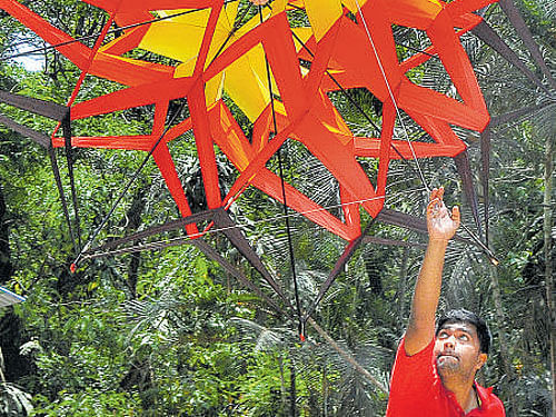 A kite-flyer shows his skills at a press conference in the city on Thursday.