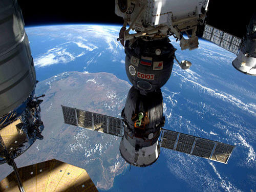 A NASA image showing the International Space Station as it flew over Madagascar showing three of the five spacecraft docked to the station. Reuters
