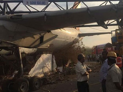 The aircraft (Airbus A-320 model) belonging to Air India was being transported by road from Begumpet airport to Central Training Establishment at Ferozguda in Balanagar here when the crane bars got bent down and the aircraft suddenly fell on a nearby compound wall. Image courtesy: ANI Twitter