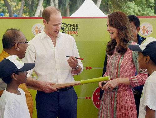 Prince William, Duke of Cambridge being greeted by school children during a charity program at Oval Maidan in Mumbai on Sunday. PTI Photo
