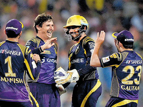 STILL GOING STRONG: Kolkata Knight Rider's  Brad Hogg celebrates with team-mates after taking the wicket of Pawan Negi      of Delhi Daredevils at the Eden Gardens on Sunday . Pti