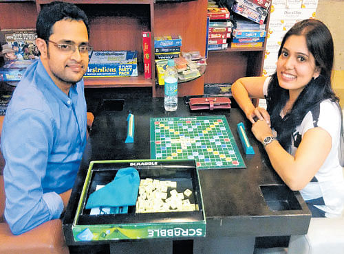 INTERESTING Priyanka enjoying a game of Scrabble with Ram Mohan.