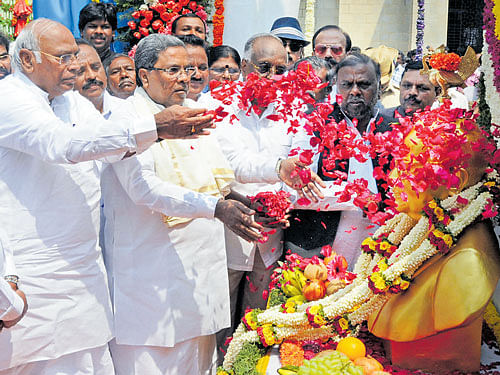 MPMMallikarjun Kharge, Chief Minister Siddaramaiah, Legislative Council Chairman D H Shankaramurthy pay floral tribute to Dr B R Ambedkar statue, on his 125th birth anniversary in Bengaluru on Thursday. DH photo