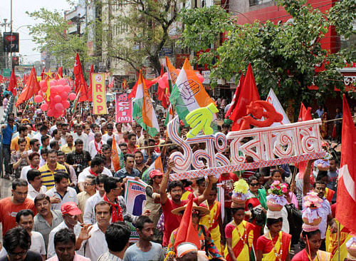 CPI(M) supporters during an election campaign rally for the upcoming assembly polls in Siliguri on Friday. PTI Photo