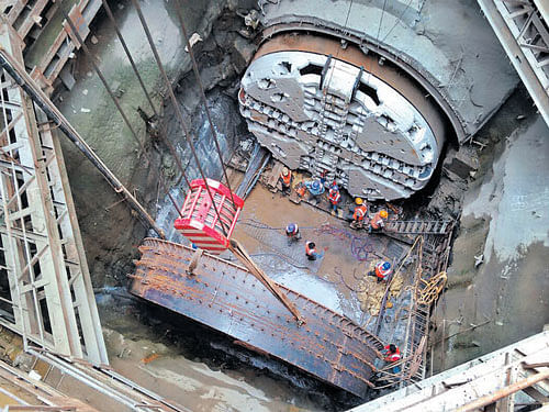 The newcutter-head of the tunnel boring machine Godavari is being fitted to the machine byNammaMetro workers near Sampige station in Bengaluru on Monday. PHOTO BY BMRCL