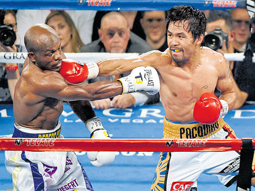 class apart Manny Pacquiao (right) showed he had plenty left in him when he knocked out Timothy Bradley Jr in what was his final boxing bout. afp