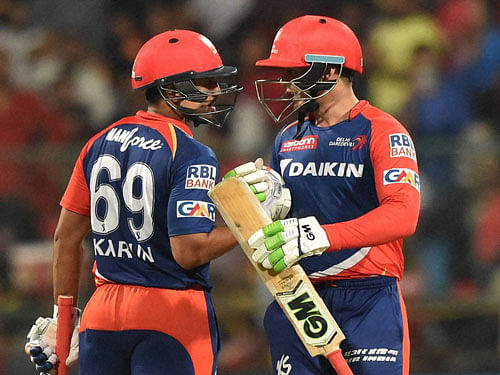 Delhi Daredevils Quinton De Cock and Karun Nair against Royal Challengers Bangalore during Indian Premier League (IPL) 2016 T20 match in Bengaluru on Sunday. PTI Photo