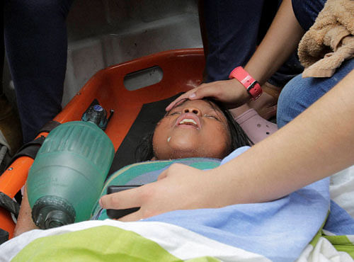 A girl is rescued from the rubble in Pedernales, Ecuador, Sunday, April 17, 2016. Rescuers pulled survivors from rubble Sunday after the strongest earthquake to hit Ecuador in decades flattened buildings and buckled highways along its Pacific coast. PTI