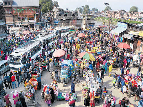 Back to normal: Life returns to normal after five days of curfew and strike following the killing of five civilians, in Srinagar on Monday. PTI