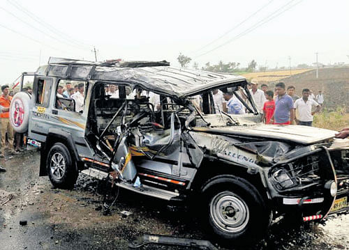 The Land Cruiser which caught fire after it toppled following a tyre burst, killing two persons near Mudhol in Bagalkot district on Monday. DH&#8200;photo