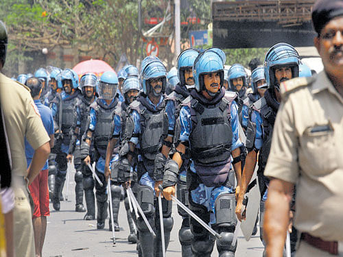 under control Rapid Action Force (RAF) personnel patrol T Dasarahalli and Jalahalli Circle on Wednesday. DH PHOTO