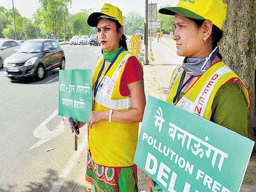 Volunteers at a traffic signal in New Delhi.  PTI FILE&#8200;Photo