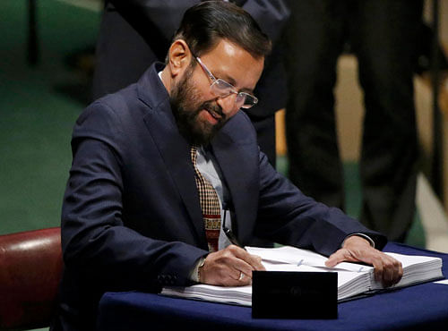 Indian Union Minister of State for Environment, Forests and Climate Change Prakash Javadekar signs the Paris Agreement on climate change at the United Nations Headquarters in New York. Reuters photo