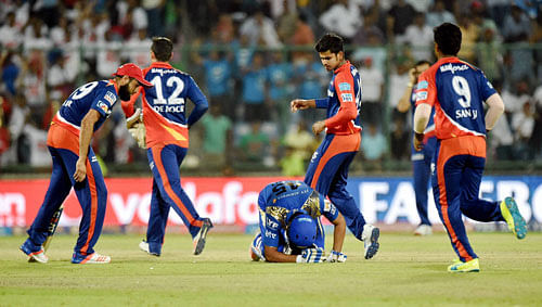 Delhi Daredevils players celebrate after their win over Mumbai Indians in the IPL T20 match in New Delhi on Saturday. PTI Photo