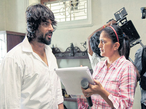 Filmmaker Sudha Kongara (right) with actor  R Madhavan on the sets of the film 'Irudi Suttru'.