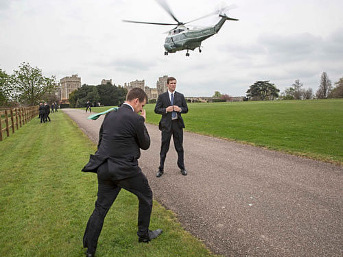 Secret Service agents stand on duty as one of the U.S. President's helicopters lands at Windsor Castle where President Barack Obama and his wife Michelle attended a private lunch with Britain's Queen Elizabeth and Prince Philip, in Windsor, Britain, April 22, 2016. REUTERS