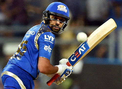 Leading from the front: Mumbai Indians' Rohit Sharma pulls one to the boundary during his match-winning 49-ball 68 not out against Kolkata Knight Riders on Thursday. PTI