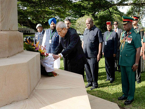 President Pranab Mukherjee laying a wreath at Bomana War Cemetery at Port Moresby in Papua New Guinea on Thursday. PTI Photo.