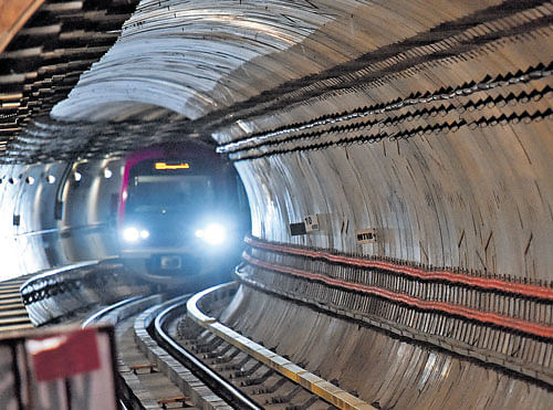 A&#8200;Metro train chugs into the underground section between Cubbon Park and the City railway station on Friday.DH Photo
