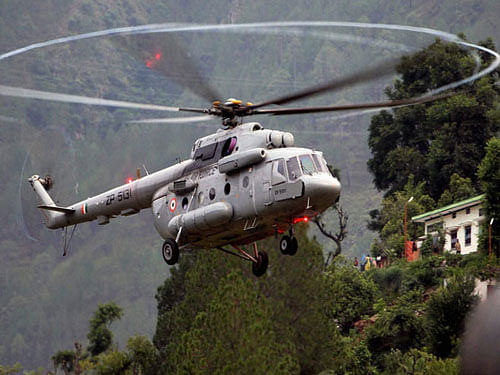 While three NDRF teams and one SDRF company are busy dousing the flames in different parts of the state, two IAF choppers have been sent to Nainital and Pauri districts, among the worst hit, to spray water over the burning jungles, Raj Bhawan officials here said. PTI file photo