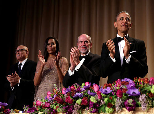 President Barack Obama applauds at the White House Correspondents' Association annual dinner in Washington. Reuters photo