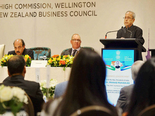 President Pranab Mukherjee addressing a business gathering at Auckland in New Zealand on Sunday.PTI Photo.