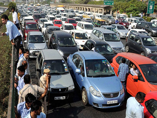 Heavy traffic jam during protest of diesel taxi drivers and owners who jammed the Delhi- Gurgaon expressway at border near Rajokri flyover in protest the ban of diesel taxi in National Capital on Monday. PTI Photo