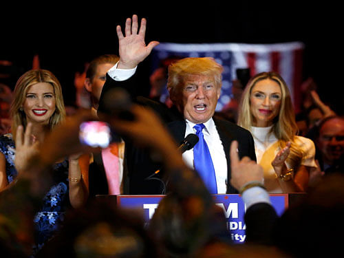 Republican U.S. presidential candidate and businessman Donald Trump waves after speaking to supporters following the results of the Indiana state primary at Trump Tower in Manhattan, New York. Reuters