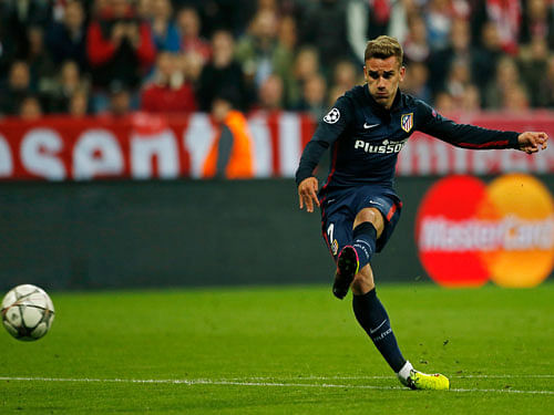 Antoine Griezmann scores the first goal for Atletico Madrid. Reuters.