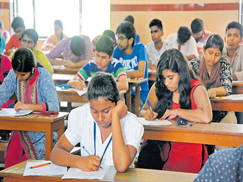 Testing time: Students take the mathematics exam in the Common Entrance Test (CET) for professional courses at St Anne's PU College for Girls in Bengaluru on Wednesday.