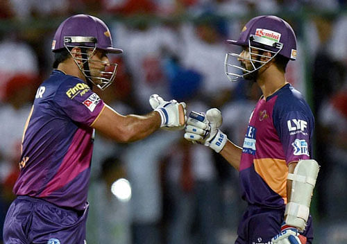 Rising Pune Supergiants players M S Dhoni with A Rehane during an IPL T20 match against Delhi Daredevils in New Delhi on Thursday. PTI Photo