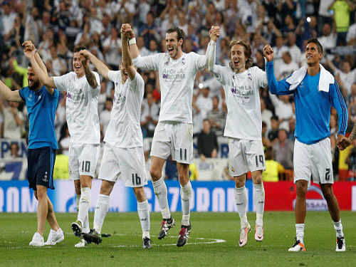 Real Madrid's Gareth Bale, who scored the winner against Manchester City, celebrates with his team-mates on&#8200;Wednesday. Reuters
