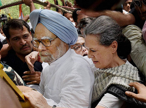 Pushed against the wall: Congress president Sonia Gandhi and former prime minister Manmohan Singh during their 'Save Democracy March' in New Delhi on Friday. PTI