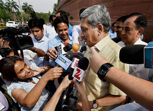 Defence Minister Manohar Parrikar talks to the media after the debate on AgustaWestland scam in Lok Sabha during the Parliament session in New Delhi on Friday. PTI Photo
