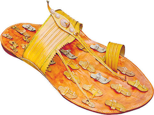 'sole'ful A gigantic Kolhapuri chappal, (right) artist Kanika Bawa's creation.