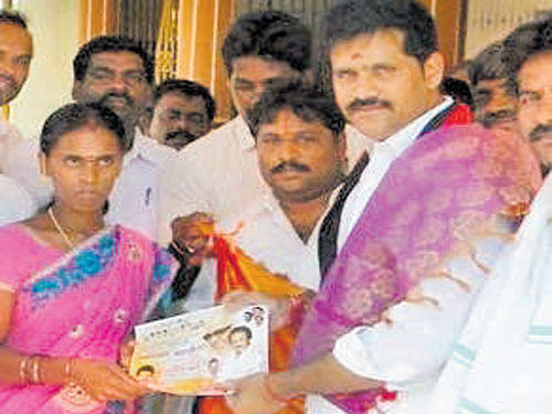 DMK sitting MLA C H Sekhar of Gummidipoondi constituency seeks support of Praveena, whose name is the first in the voter list