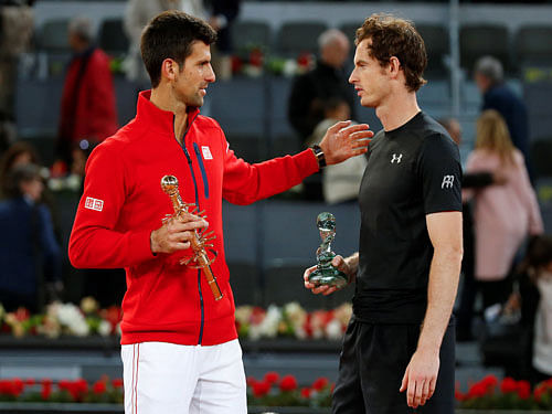 Novak Djokovic of Serbia v Andy Murray of Britain - Madrid, Spain - 8/5/16 Djokovic and Murray talk during the trophy ceremony. REUTERS