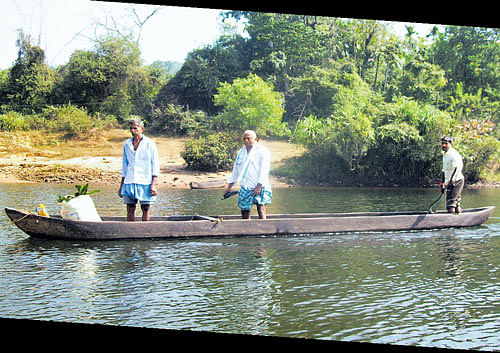 Pristine: Villagers in their canoe on River Sharavathi. PHOTOS by author