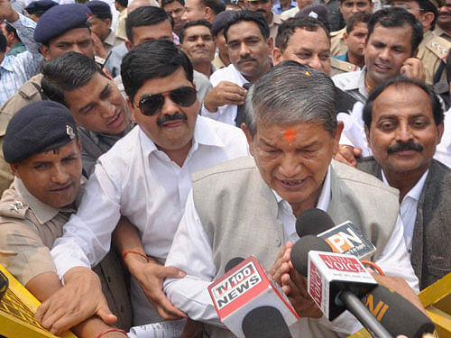 Former Chief Minister Harish Rawat talks to the media after the end of crucial Uttarakhand Assembly floor test, at party office in Dehradun on Tuesday. PTI Photo.
