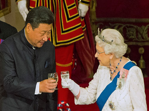 Chinese President Xi Jinping with Queen Elizabeth II at a state banquet at Buckingham Palace, London, during the first day of his state visit to Britain. Tuesday October 20, 2015. Reuters File Photo.