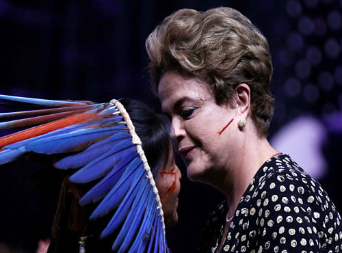 Brazil's President Dilma Rousseff greets an indigenous woman during the Opening ceremony of the National Policy Conference for Women in Brasilia. Reuters photo